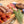The Smoker box: beef sausages, skewers and steak on a wooden board with rosemary